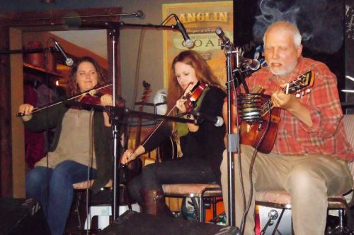 Folk singer Bob Miller with fiddlers Meghan and Kaitlin Balogh performed at The Crossing Pub on November 26